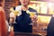 Handsome bartender serving cocktails in a pub