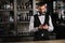 handsome bartender using smartphone