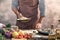 Handsome bearded cheef cook prepairing spaghetti on a kitchen