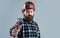 handsome bearded guy with beard and moustache hold hammer, selective focus, builder