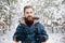 Handsome Bearded Hiker Smiling in Winter Forest