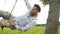 Handsome bearded man with a beard on a swing.