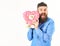 Handsome bearded man happy face holds valentines heart