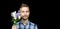 Handsome bearded stylish man with bouquet of tender wild flowers on black background with copy space. Greeting card, pastoral