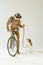 handsome bicycler looking at dog with leash