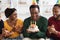 Handsome black birthday guy holding cake with lit candles