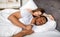 Handsome black guy and his Caucasian wife sleeping together in bed at home