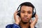 Handsome black man listening to music with headphones