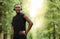 Handsome black sportsman posing at city park