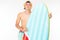 Handsome blond man with an air mattress in the form of a surfboard on a white background