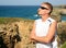 Handsome blond man enjoy Las Catedrales beach Ribadeo Spain