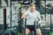 Handsome bodybuilder exercising with battle ropes during functional training