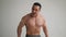 Handsome bodybuilder posing on white background. Fitness muscular body