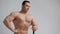 Handsome bodybuilder posing on white background. Fitness muscular body