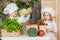 Handsome boy and beautiful young girl playing in the kitchen chefs. Healthy food. Vegetables