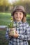 Handsome boy with dandelion flower summer outdoors