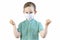 A handsome boy in a green shirt and a medical mask on his face bent his elbows and shows his fist. Stop covid-19. White background