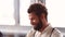 Handsome businessman talking with colleagues in meeting room