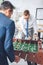 handsome businessmen playing table football