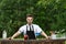 Handsome caucasian barman standing near a bar counter. Concept o