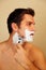 Handsome Caucasian male shaving