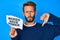 Handsome caucasian man with beard showing words have power banner with angry face, negative sign showing dislike with thumbs down,