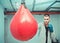 Handsome concentrated male boxer trains hand punches