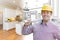 Handsome Contractor in Hard Hat Over Custom Kitchen Drawing and Photo