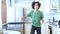 handsome curly guy dancer cheerfully dancing at home in the kitchen