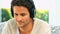 Handsome dark haired man listening to music