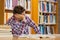 Handsome distracted student studying his books