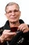 Handsome elderly man drinking coffee