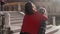 Handsome european man carrying on his back gorgeous asian woman in the streets of Venice. Young hipster couple in love