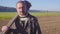 Handsome farm worker with beard with farm tools protrait