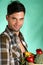 Handsome farmer holding vegetables