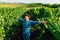 handsome farmer winemaker with his hands up. caucasian farmer with hat