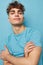 handsome guy in blue t-shirts with a pumped-up body isolated background