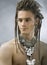 Handsome guy with dreadlocks and jewelry