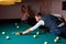 handsome guy pro billiard player finding best solution and right angle