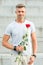 Handsome guy with rose flower romantic date. Valentines day and anniversary. Flowers delivery. Dating services. How to