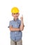 Handsome happy future builder dressed in blue checkred shirt grey jeans and yellow helmet, gesturing on white background