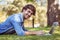 handsome hipster using laptop in park