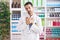 Handsome hispanic man working at pharmacy drugstore smiling with hands on chest with closed eyes and grateful gesture on face