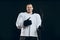 Handsome hockey player. Smiling at camera isolated on black background.