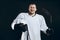 Handsome hockey player. Smiling at camera isolated on black background.