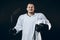 Handsome hockey player. Smiling at camera isolated on black background.