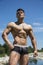 Handsome, hot young bodybuilder shirtless in trunks