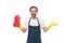 Handsome household worker. Mature man holding detergent bottle in rubber gloves. Senior man in apron ready for