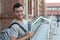 Handsome joyful mixed race person heading to school