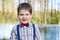 Handsome little boy in shirt and bow tie grimaces